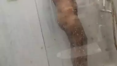 Desi girl under shower naked bath caught on camera