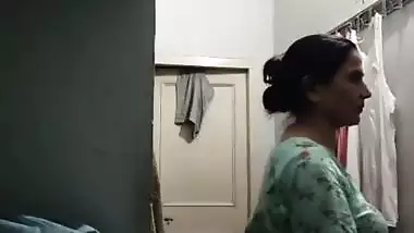 Mom changing dress caught on camera by horny son