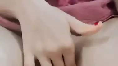 Nude Bhabhi presses boobs and fingers her pussy